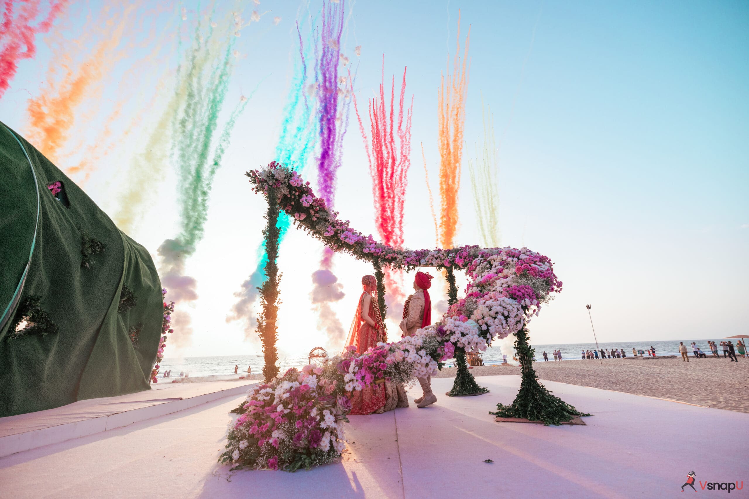 Bride and groom enjoy the mesmerizing view of skyshoots at their destination wedding stage.